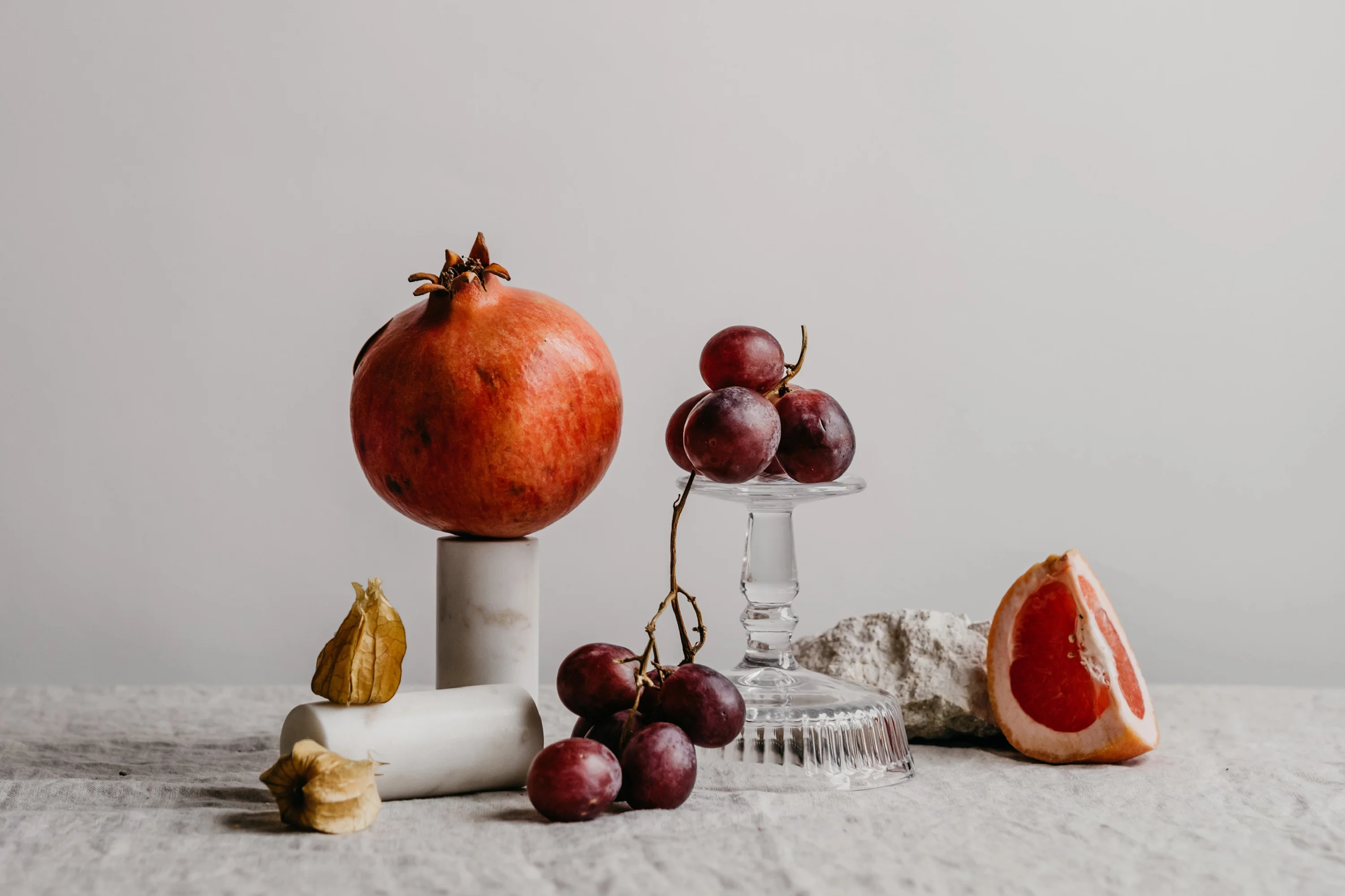 fruits balancing on glassware